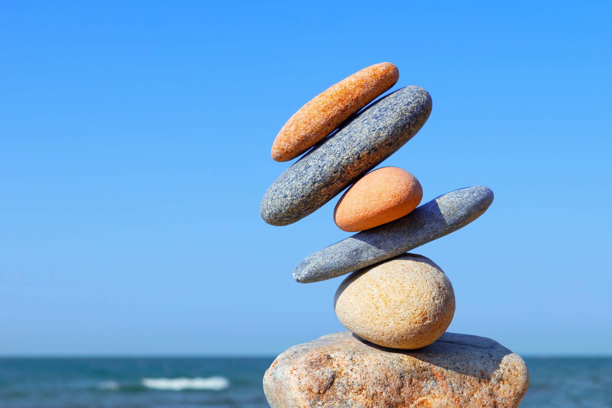 Unstable construction of multi-colored stones. The disturbed equilibrium. Imbalance concept.