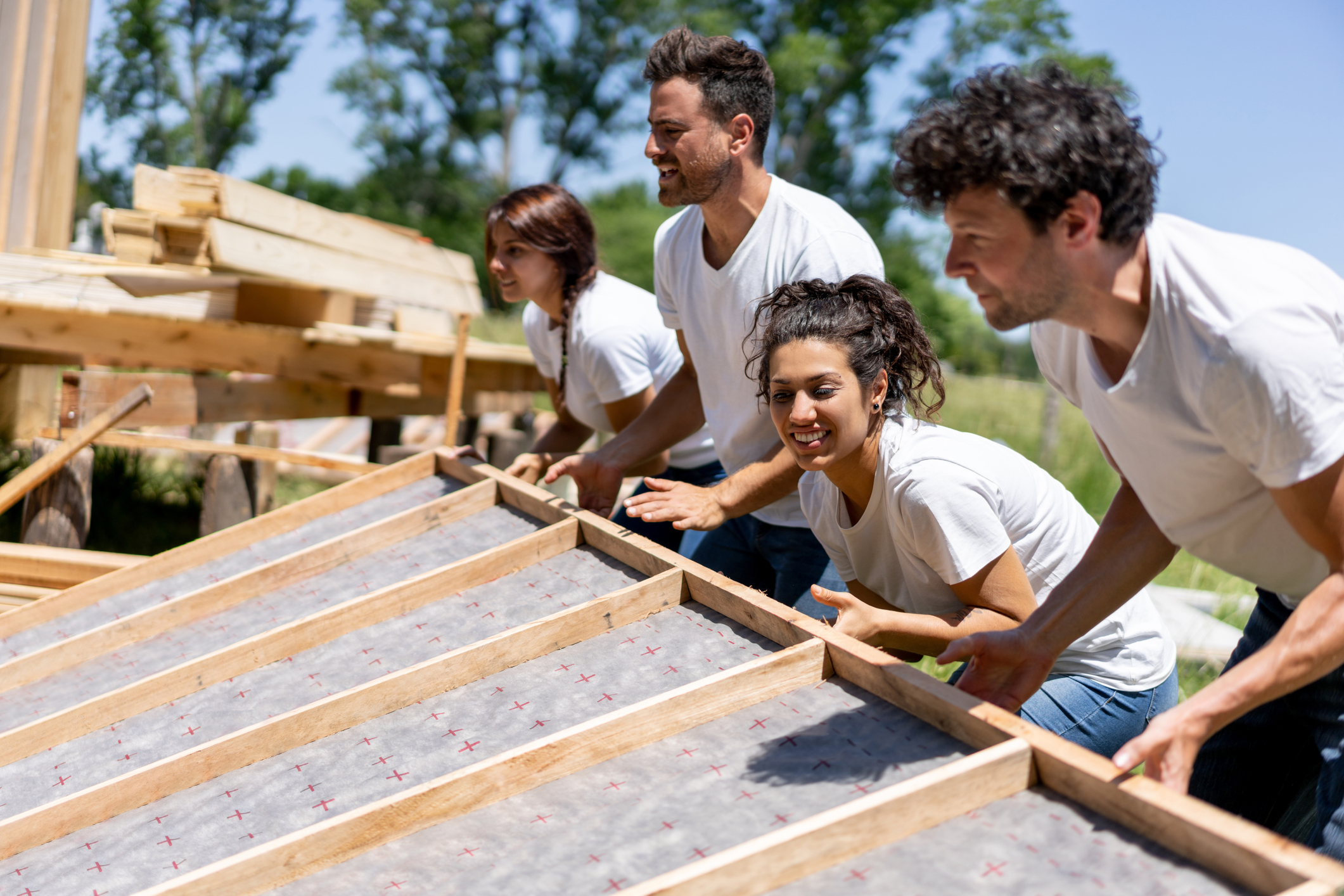 Latin american volunteers working hard at a charity construction project